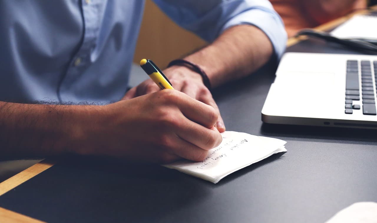 contact page illustration with man writing notes